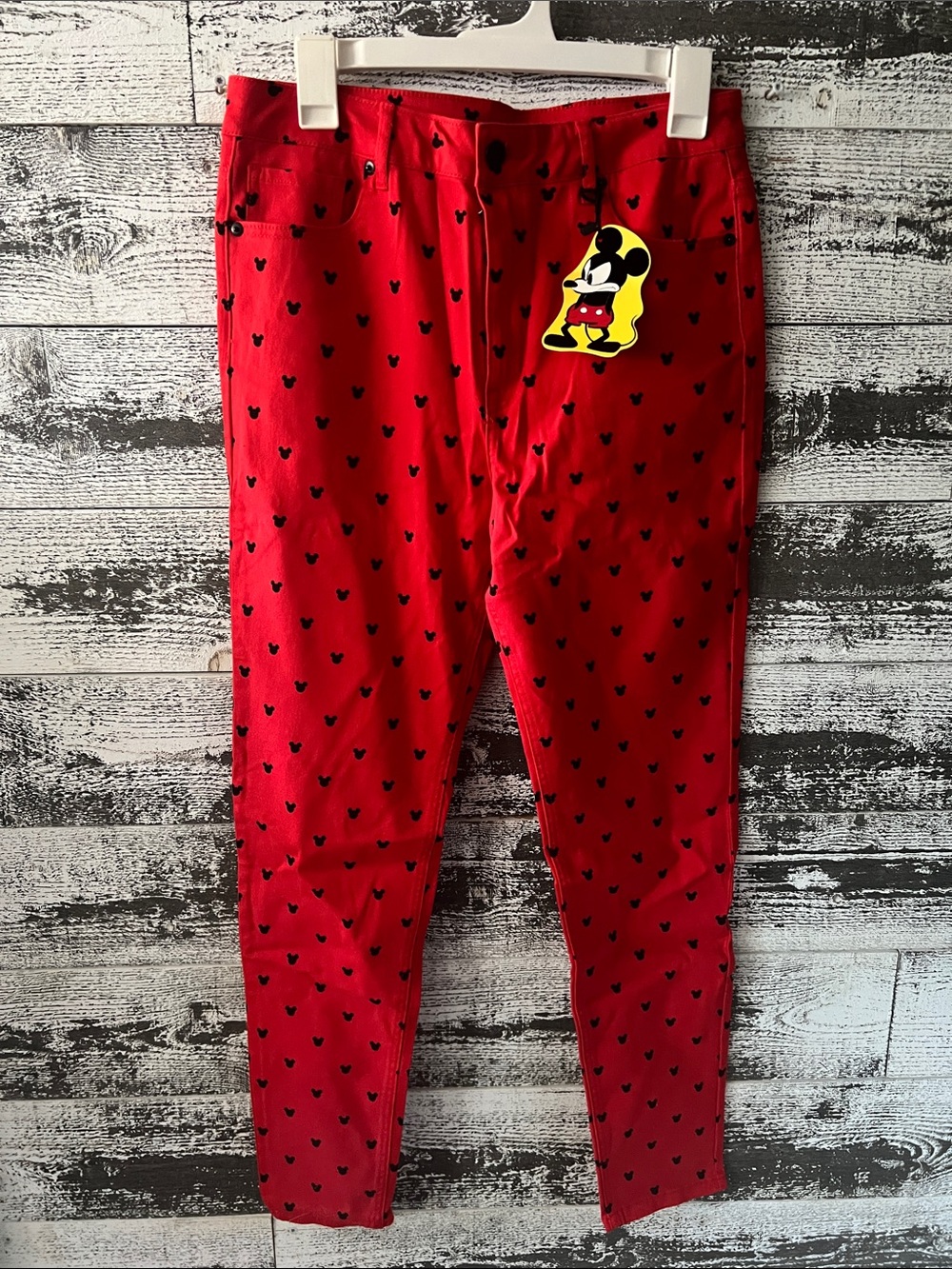 Women’s NWT Disney x Forever 21 collab red pants with black Mickey pattern.